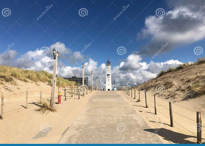 Lighthouse Noordwijk Stone Dirt Road between Sandy Hills and Noordwijk Lighthouse on ... photo